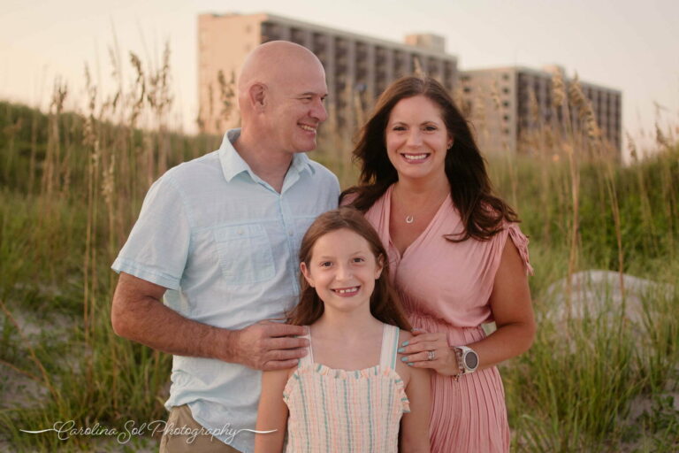 Lifestyle Family Photography on Wrightsville Beach, NC in front of the Shell Island Resort.