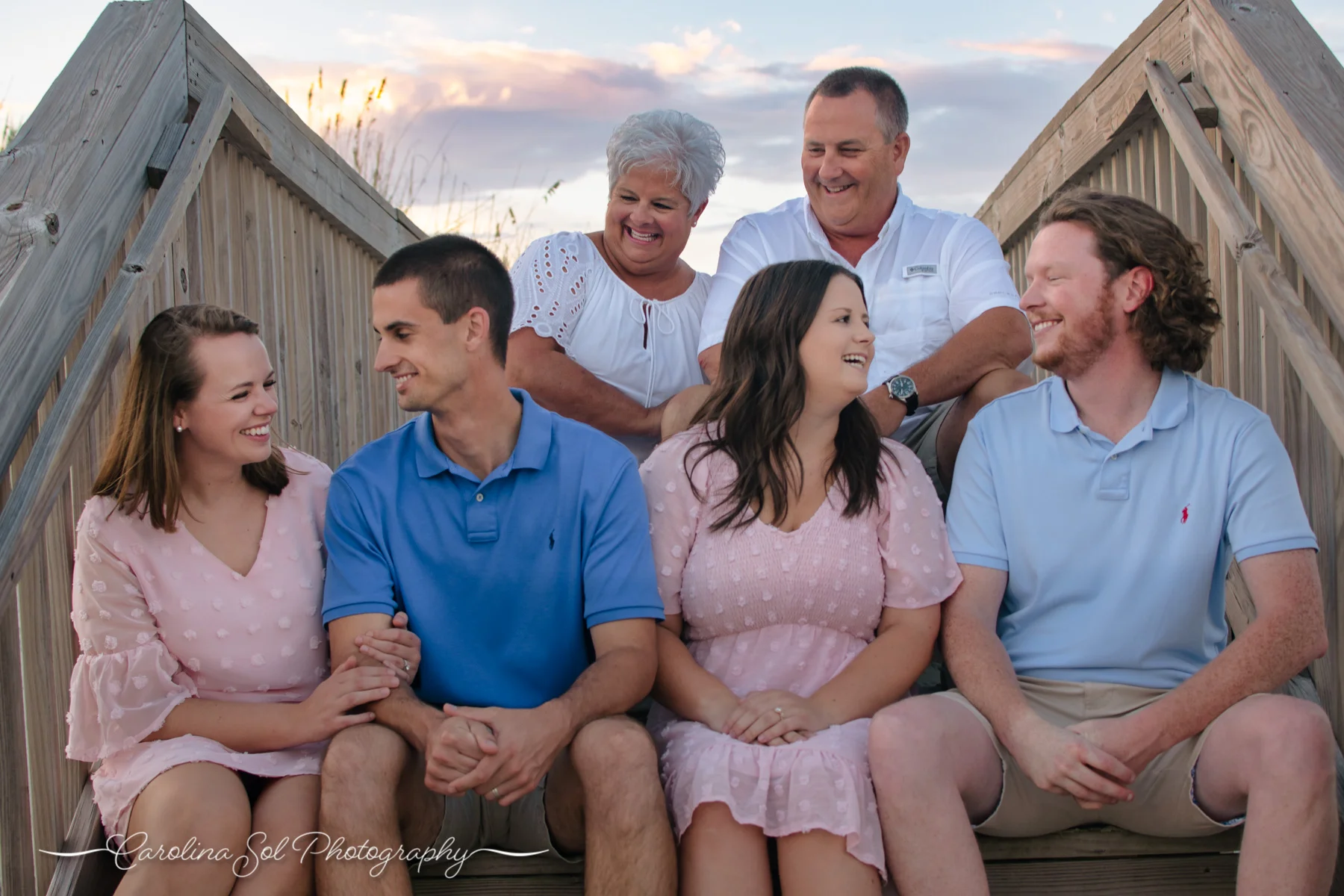 Lifestyle family photography session on boardwalk in Sunset Beach, NC.