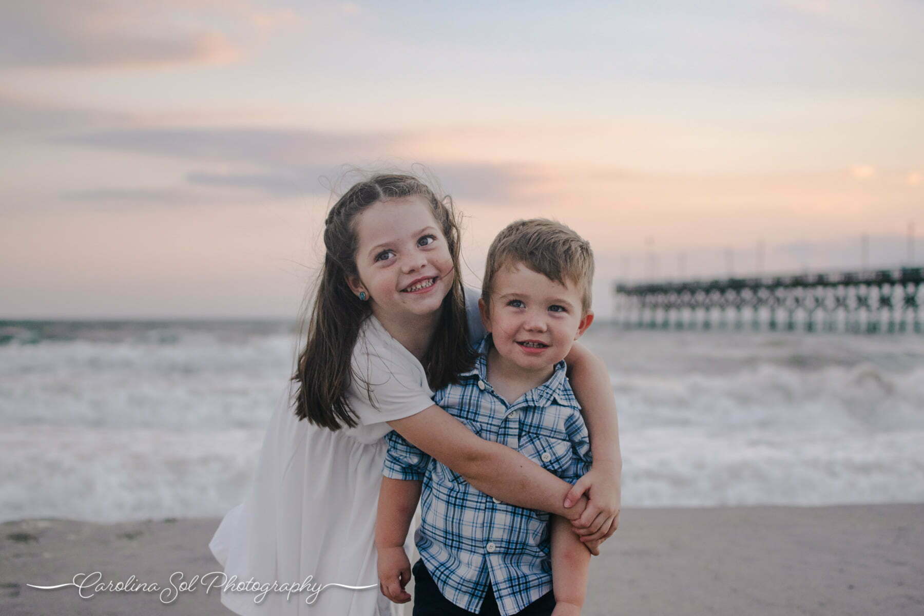 Oak Island beach family photography during sunset.