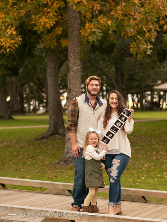 Maternity photography pregnancy announcement session at Sunset Beach Park, NC.