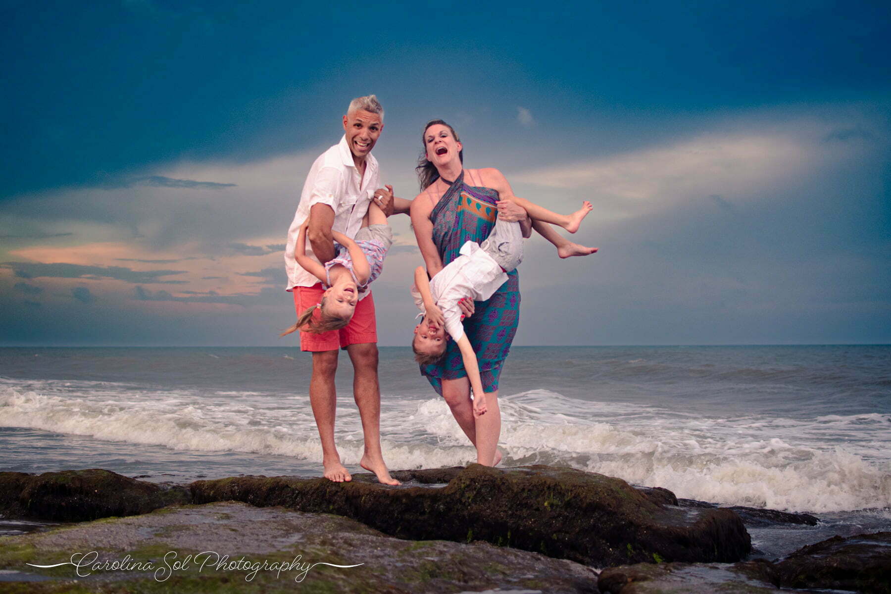 Candid lifestyle family portrait photography session on Kure Beach, NC.