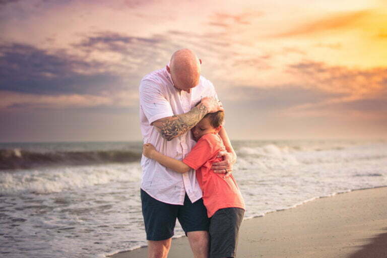 Father and son lifestyle portrait photography session at sunset Holden Beach, NC.