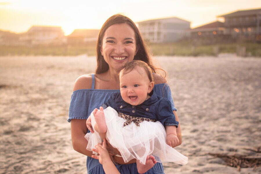 Lifestyle newborn family photography session on Holden Beach, NC.