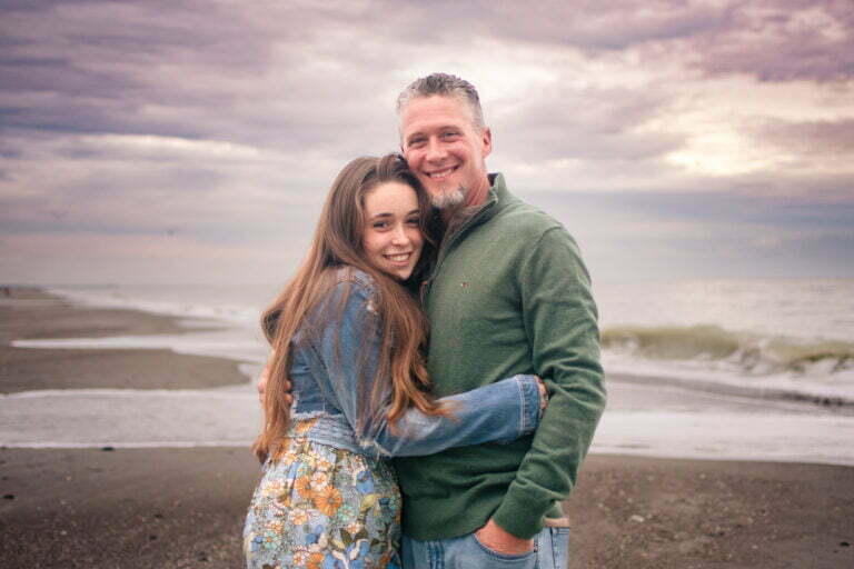 Candid father and daughter family portrait photography session Holden Beach, NC.