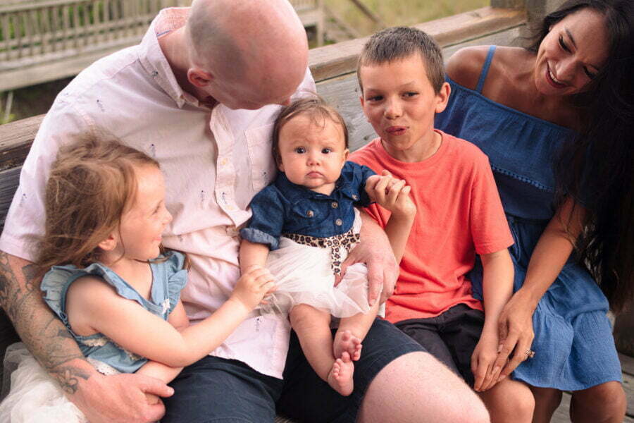 Professional lifestyle newborn family photographer Holden Beach, NC.