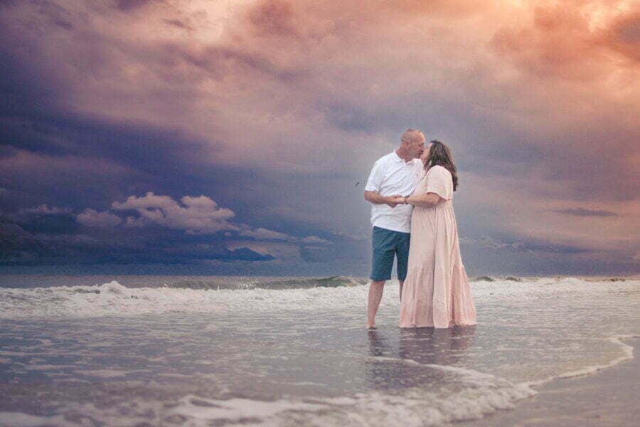 Adventure couples portrait photography at sunset in Holden Beach, NC.