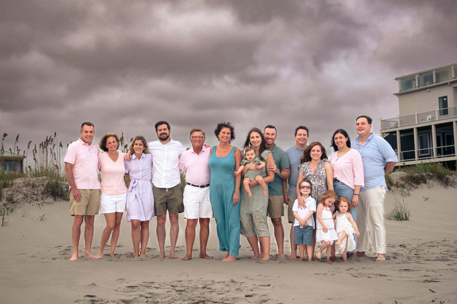 Extended family professional portrait photography on the beach Oak Island, NC.