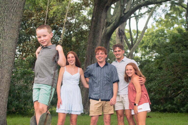 Sunset Beach, NC lifestyle family portrait photography session with swing under oak trees.