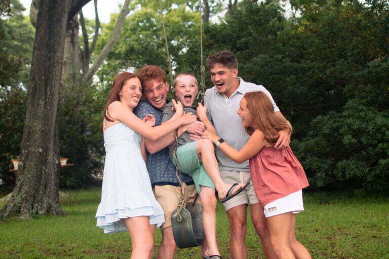 Lifestyle family photography session playing in Sunset Beach, NC.