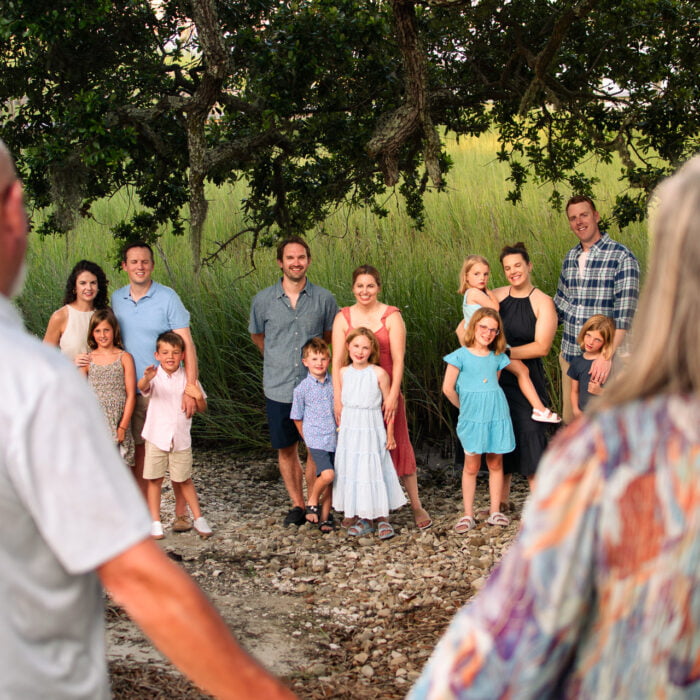 Extended family lifestyle portrait photography session under mossy oaks Sunset Beach, NC.